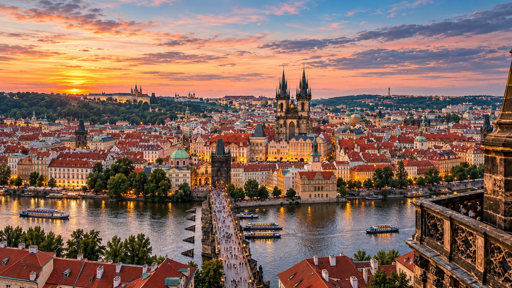 Prague at sunset seen from above — the Old Town, Charles Bridge and the river glowing in golden light